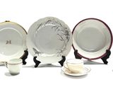 four plates and a cup on the table