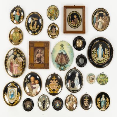an image of a collection of decorative plates and pictures on a wall