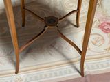 a wooden table with a marble top on a rug