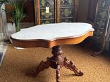 a table that has a marble top on it