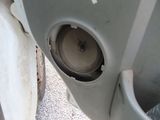 a close up of a car door with a speaker in it