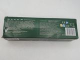 the back of a box of toothpaste sitting on a white surface