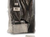 a bag of black clothing sitting on a white surface