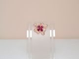 crystal butterfly brooch with pink stones on clear acrylic stand