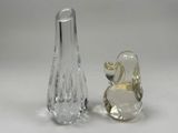 two glass vases sitting next to each other on a table