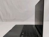 a laptop that is sitting on a white table