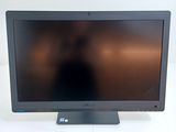 an image of a computer monitor with a blurry image of a person in the background