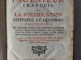 an old book with french writing sitting on top of a white table