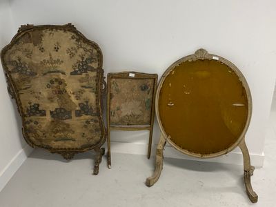 two chairs and a table in a room with a mirror on the wall