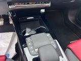 the interior of a car with the center console in the center of the car