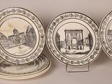 three plates with different designs on them on a table