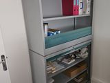a cabinet that has a lot of items on it