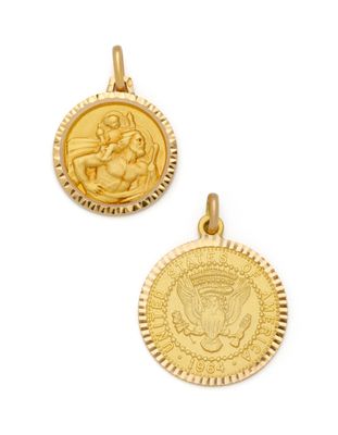 a close up of two gold medallions on a white background