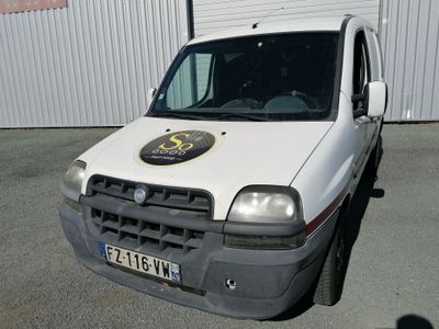 a white van that is parked in front of a building