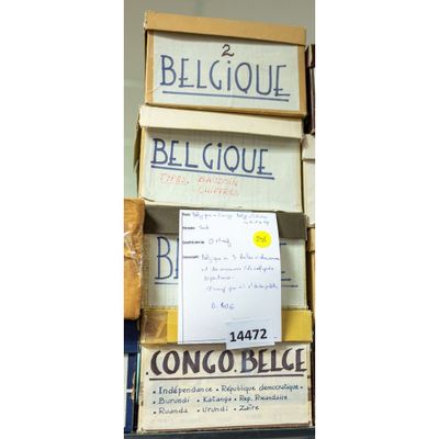 a stack of books with a sign that says beligoue