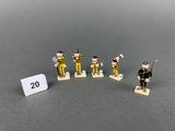 a lot of small figurines that are on a table