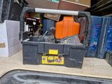 a box with tools in it sitting on the floor