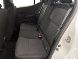the back seats of a car with a cup holder in the back of it