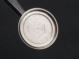 an overhead view of a metal pan with a lid and a handle
