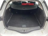 a trunk of a car with luggage in the back