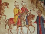 a picture of a picture of a man riding on a horse