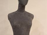 a mannequin with a crown on top of it