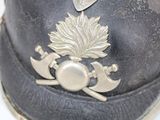 a close up of a hat with a flower on it
