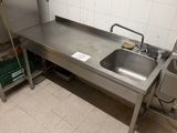 a kitchen with a sink and a stove in it