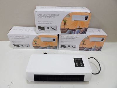 trois boîtes de purificateurs d'air posées les unes à côté des autres sur une table
