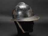 an old fireman ' s helmet on a mannequin head on a black background