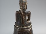 an image of a statue of a person sitting on a pedestal