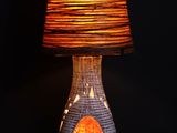 a lamp that is sitting on a table with a lamp on it