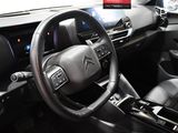 a steering wheel and dashboard of a car in a car showroom