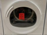 a white washer and dryer sitting on the floor