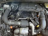 a car engine with its hood open on the street