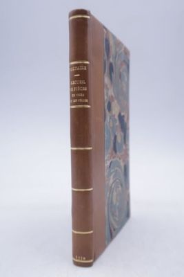 a book that is sitting on a white surface