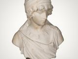 a white marble bust of a woman with a hat on her head