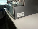 a coffee machine sitting on a counter in a kitchen