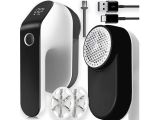 an image of a black and white device with a charger and plugs