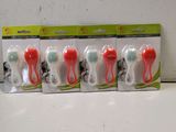 four toothbrushes in a row on top of a counter