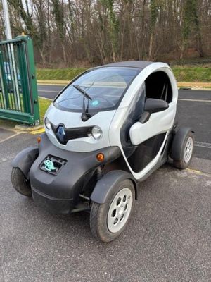 a small car that is parked in the parking lot