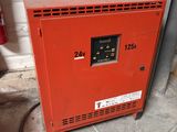 a red box with a sign on it sitting in a garage