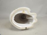 porcelain figurine of a shell with a hole in the middle of it