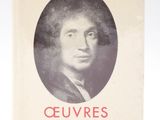an old book with a picture of a man in a black and white photo