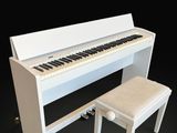 an image of a white piano and a stool on a black background