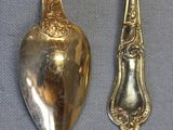 two spoons and a spoon on a table