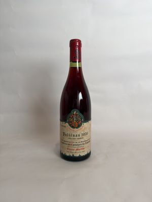 a bottle of wine that is sitting on a table