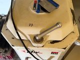 a dirty machine that is sitting on the floor