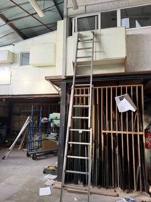 a picture of a room that has a ladder in it