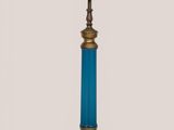 a blue lamp that is on top of a table